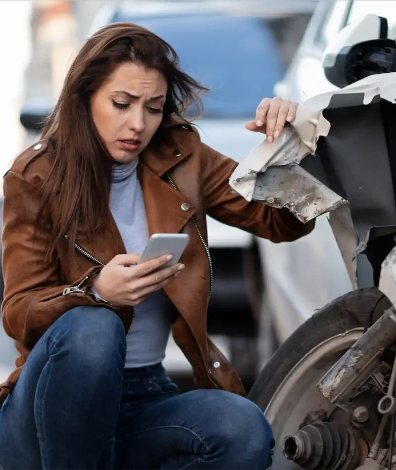 young-sad-woman-text-messaging-smart-after-car-crash-road